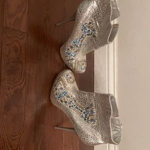 Here’s a silver bootie heel size about 4.75” women’s size 10